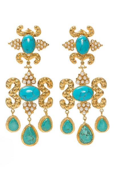product shot of gold statement earrings with turquoise stones and pearls.
